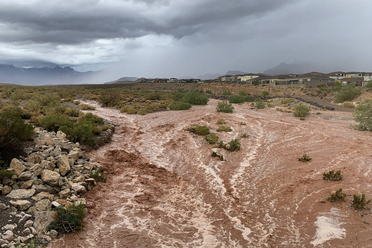 Flood waters along Charleston Boulevard near Red Rock Canyon National Conservation Area on Mond ...
