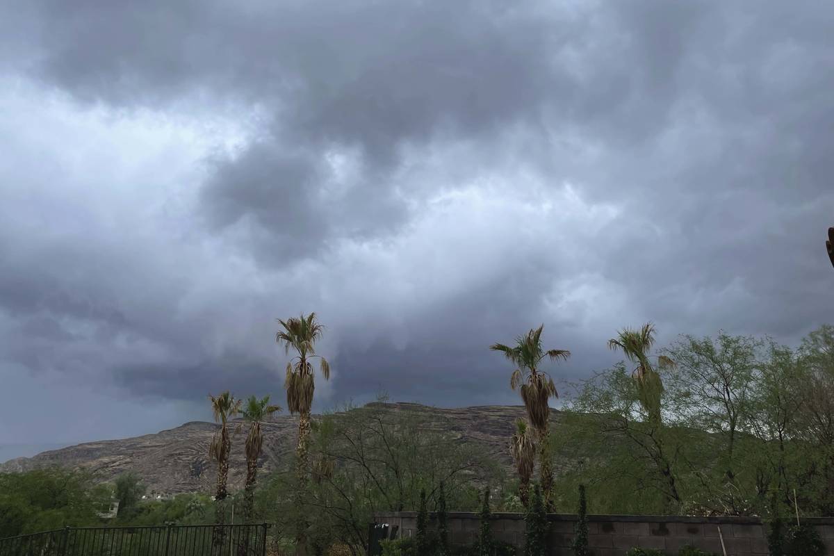 Storm clouds hang over Red Rock Canyon in western Las Vegas on Monday, July 26, 2021. (Belinda ...
