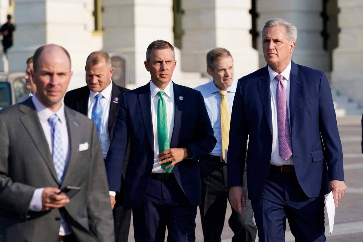 House Minority Leader Kevin McCarthy, R-Calif., right, and other Republican House members, walk ...
