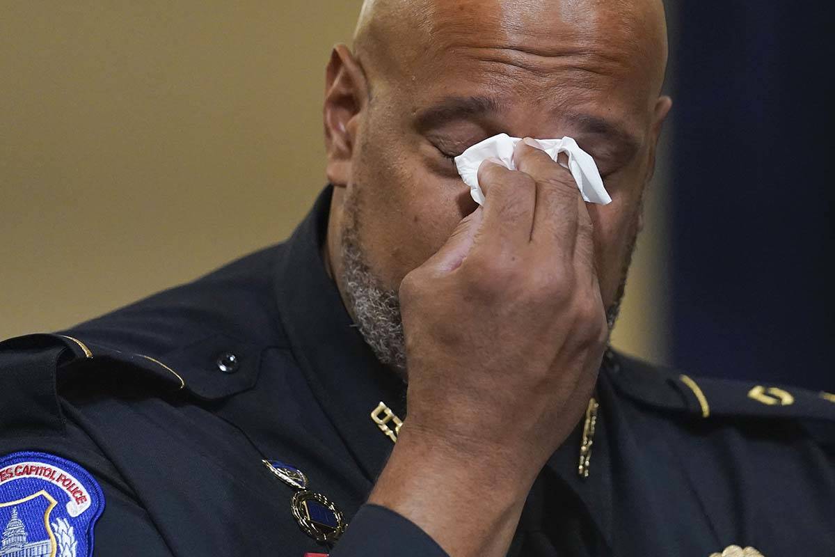Washington Metropolitan Police Department officer Daniel Hodges wipes his eyes during the House ...