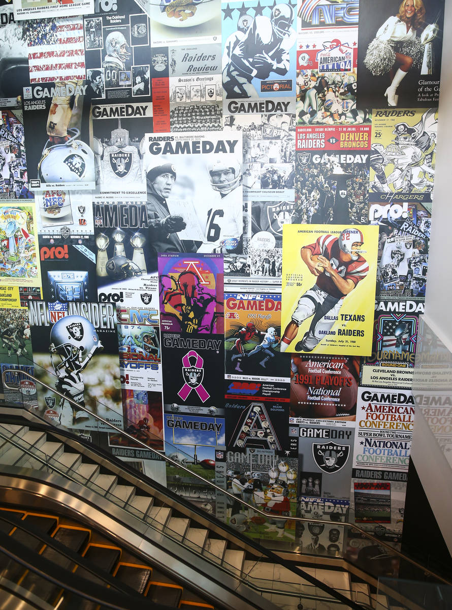 A wall stretching multiple levels highlights Raiders programs as seen during a tour of the Alle ...