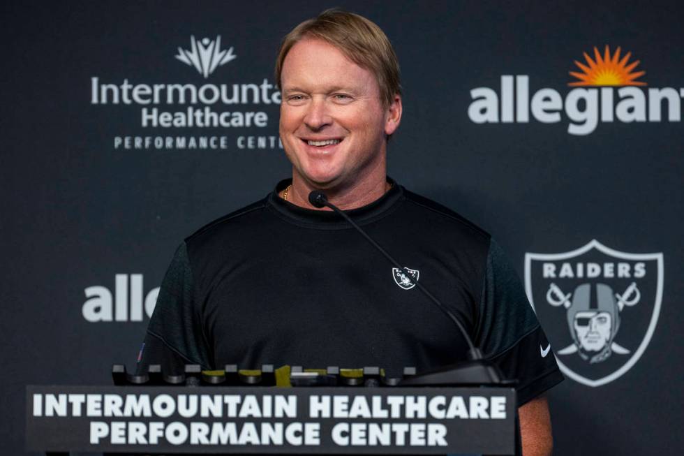 Raiders head coach Jon Gruden smiles while speaking to the media during the start of training c ...