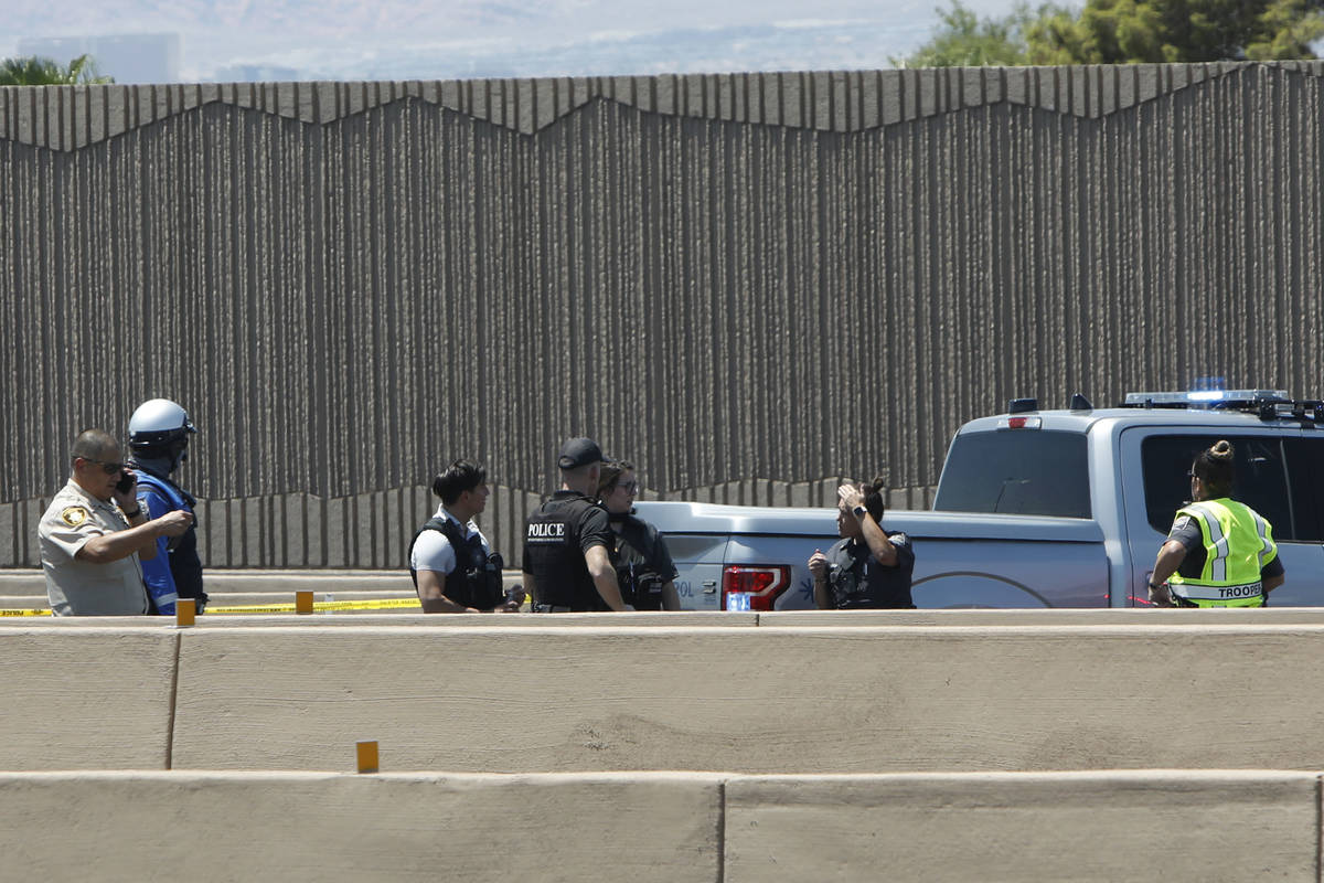 A heavy police presence is seen on Interstate 15 near Sahara Avenue in Las Vegas, Tuesday, July ...