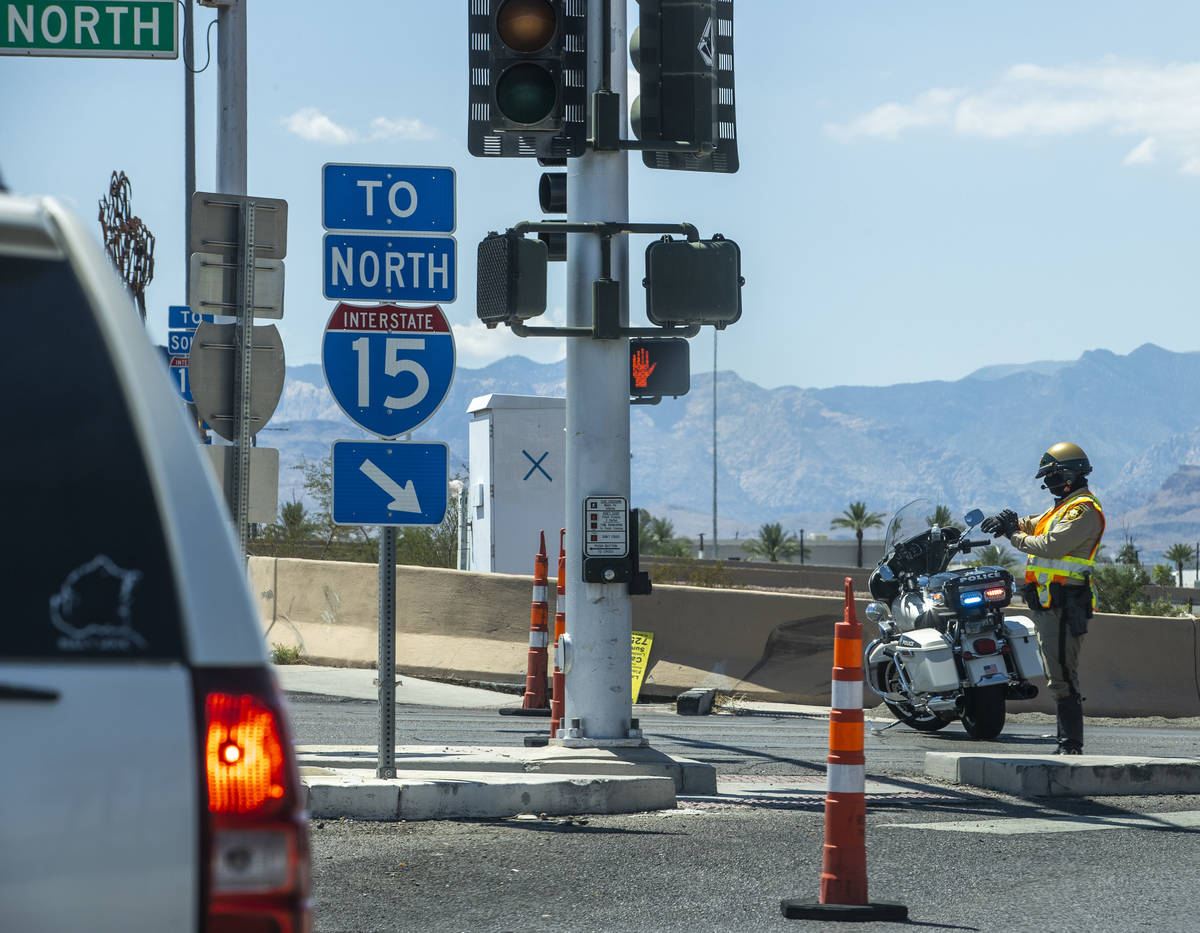 A Metro officer blocks traffic onto the I-15 northbound lanes at Russell Road due to police act ...