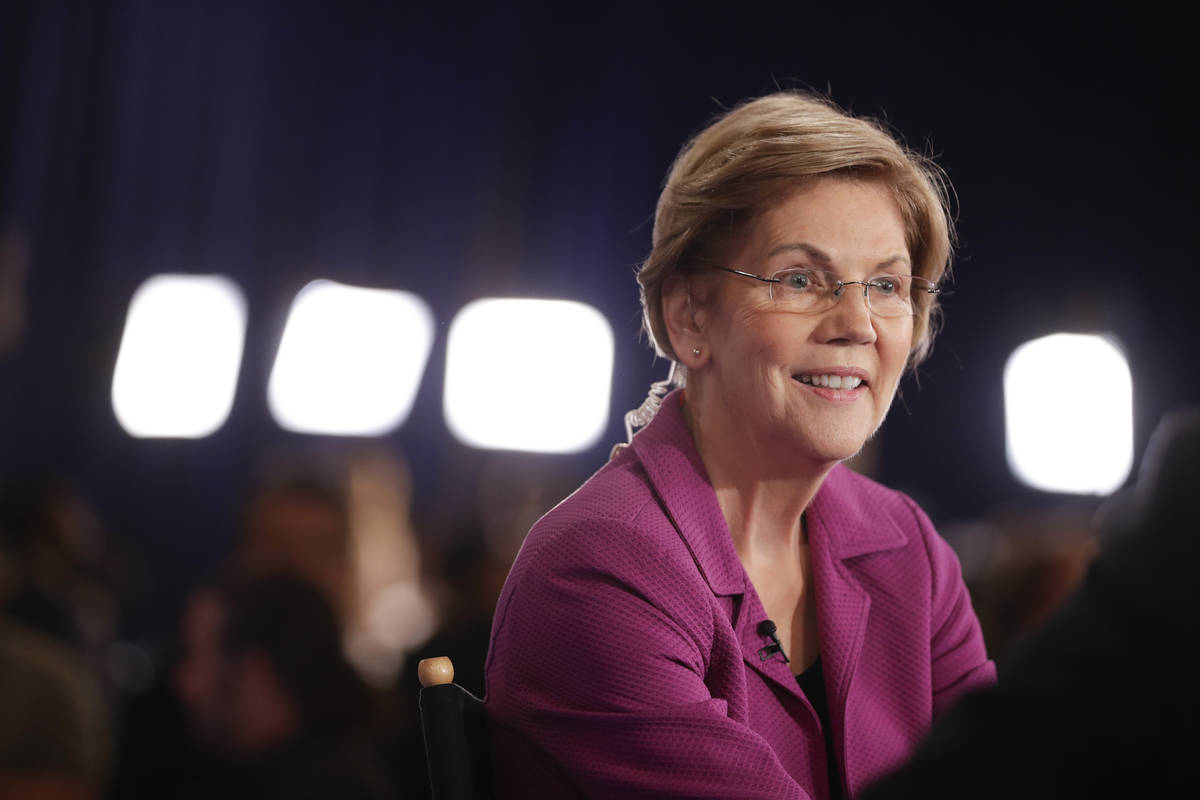 Sen. Elizabeth Warren, D-Mass., talks in the spin room after a Democratic presidential primary ...