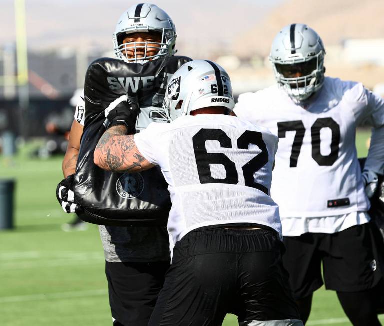 Raiders offensive guarsd Denzelle Good, left, runs through drills with Parker Ehinger (62) duri ...