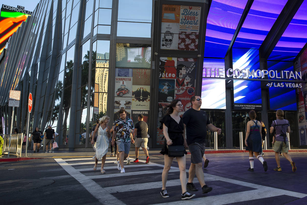 Pedestrians pass the Cosmopolitan of Las Vegas in June 2021. (Ellen Schmidt/Las Vegas Review-Jo ...