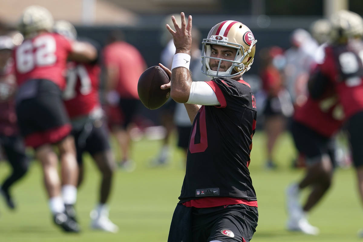 San Francisco 49ers quarterback Jimmy Garoppolo throws a pass at NFL football training camp in ...