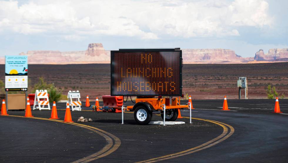 A digital sign informs visitors that houseboats cannot be launched from the Wahweap main launch ...