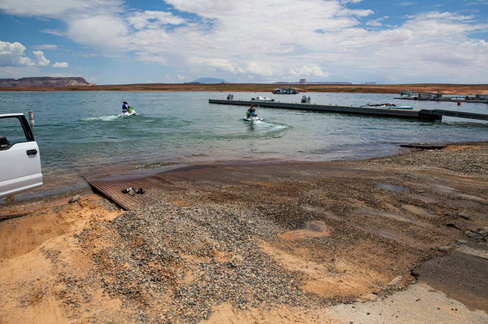 The end of the concrete Wahweap main launch ramp, which is temporarily extended with pipe mats, ...