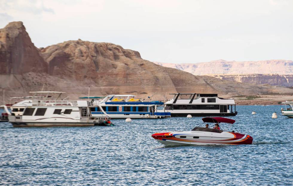 Boats are pictured near the Wahweap Marina at Lake Powell in the Glen Canyon National Recreatio ...