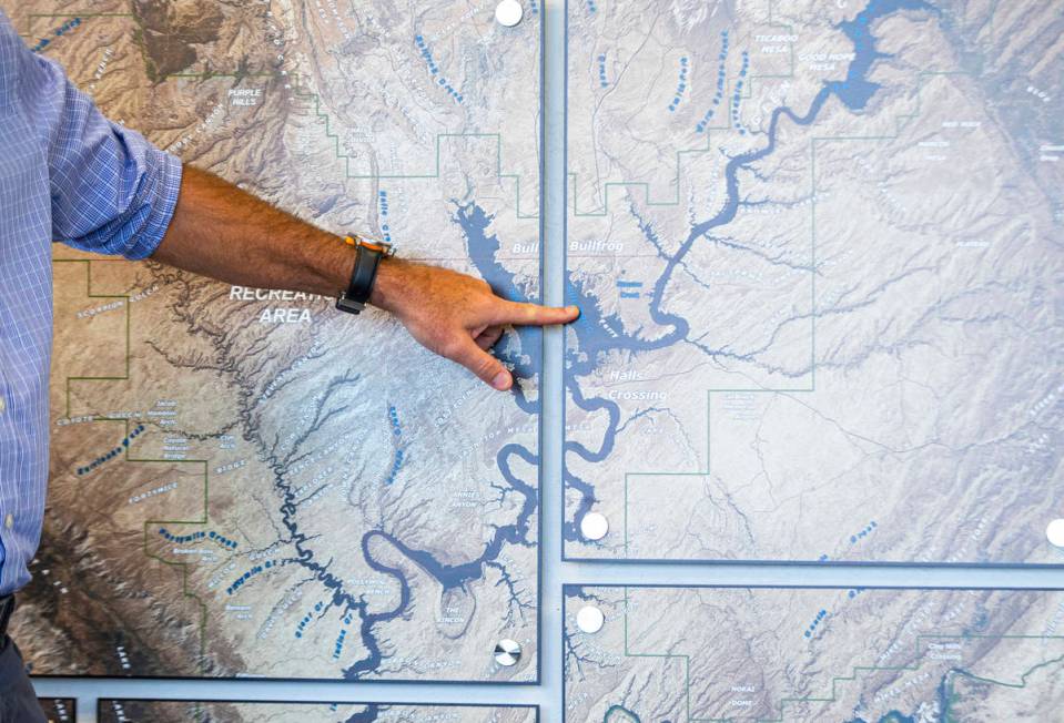 William Shott, superintendent of Glen Canyon National Recreation Area, points to a map while ta ...