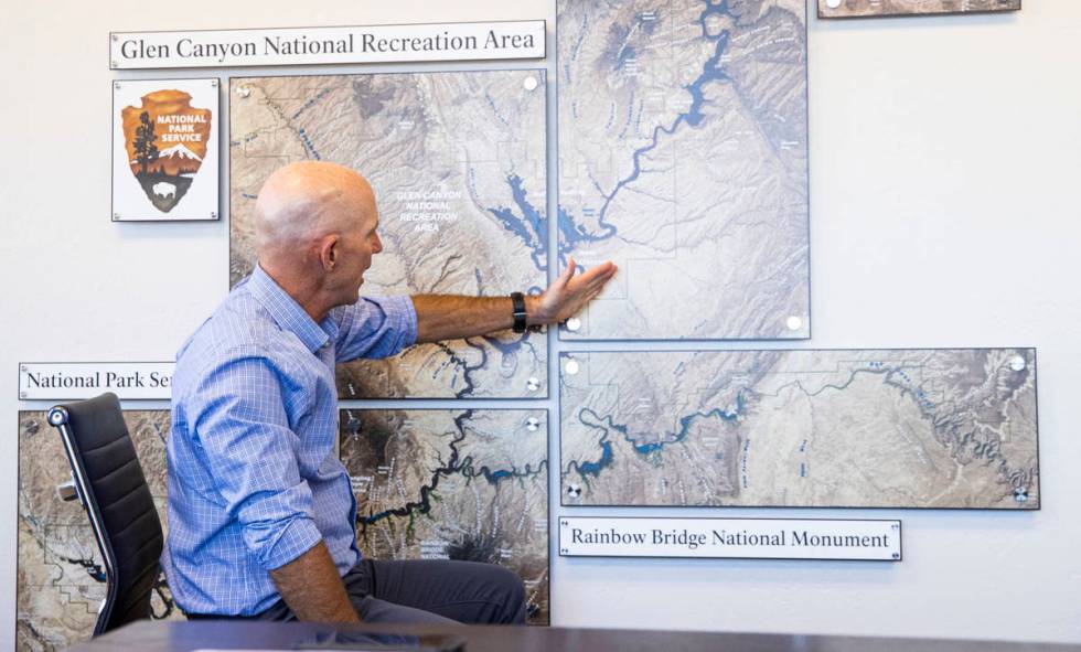 William Shott, superintendent of Glen Canyon National Recreation Area, points to a map while ta ...