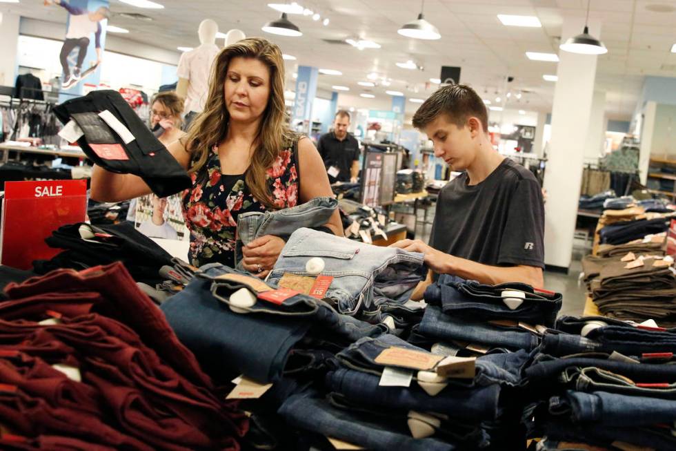 Levi Cartwright, 13, does his back to school shopping with his mother Christine at JCPenny on T ...