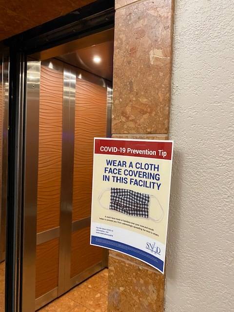 A sign asking people to wear masks inside the building is seen at the Regional Justice Center i ...