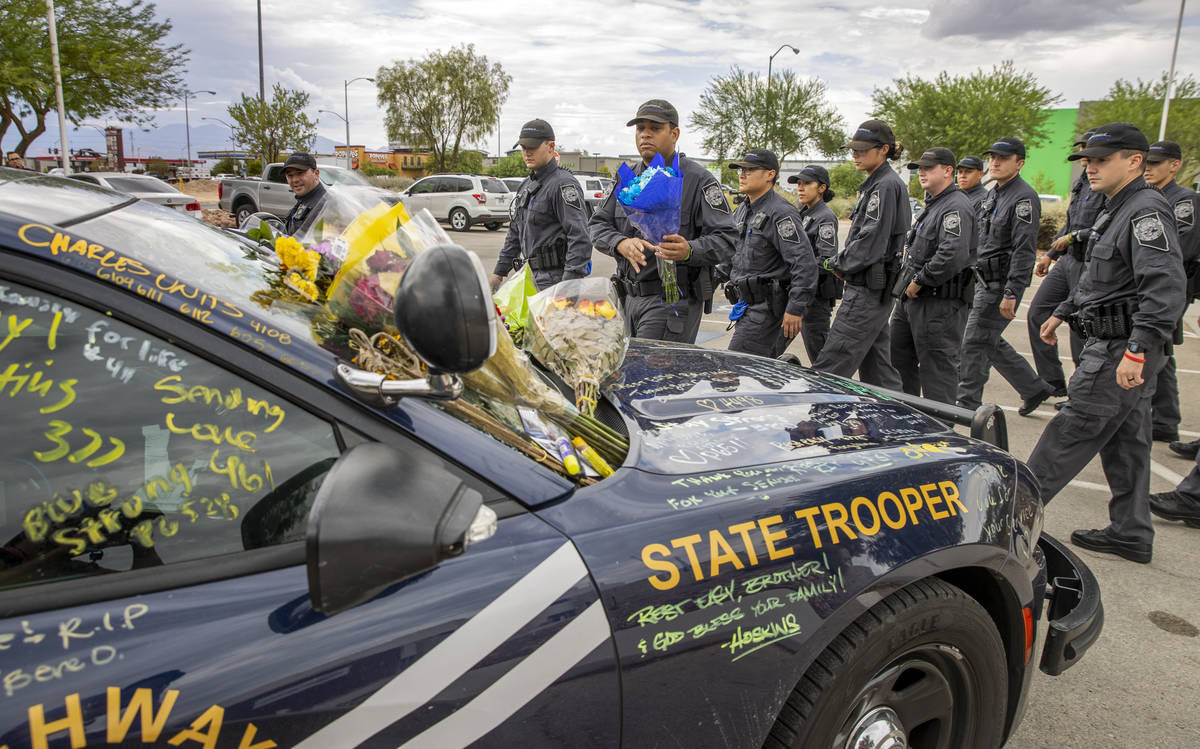 Nevada Highway Patrol cadets arrive to pay homage to trooper Micah May with his car #203 parked ...