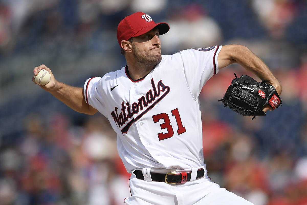 Washington Nationals starting pitcher Max Scherzer delivers a pitch during a baseball game agai ...