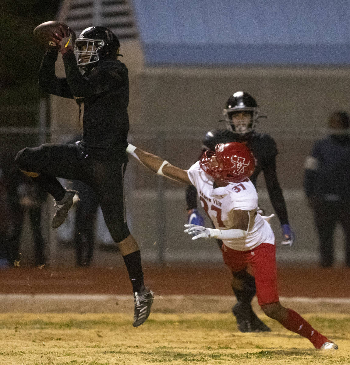 Desert Pines' Jet Solomon (11) catches the ball in the final second of the game as Arbor View's ...