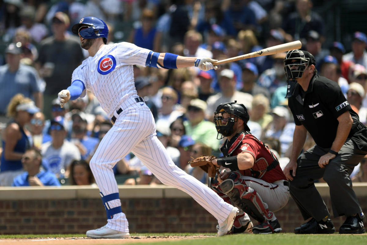 Chicago Cubs' Kris Bryant watches his two-run home run during the first inning of a baseball ga ...