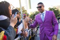 Golden Knights' Ryan Reaves signs autographs on the gold carpet after arriving for the NHL seas ...