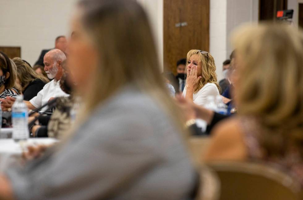 An attendee sheds a few tears along with others during a public memorial service for former Met ...