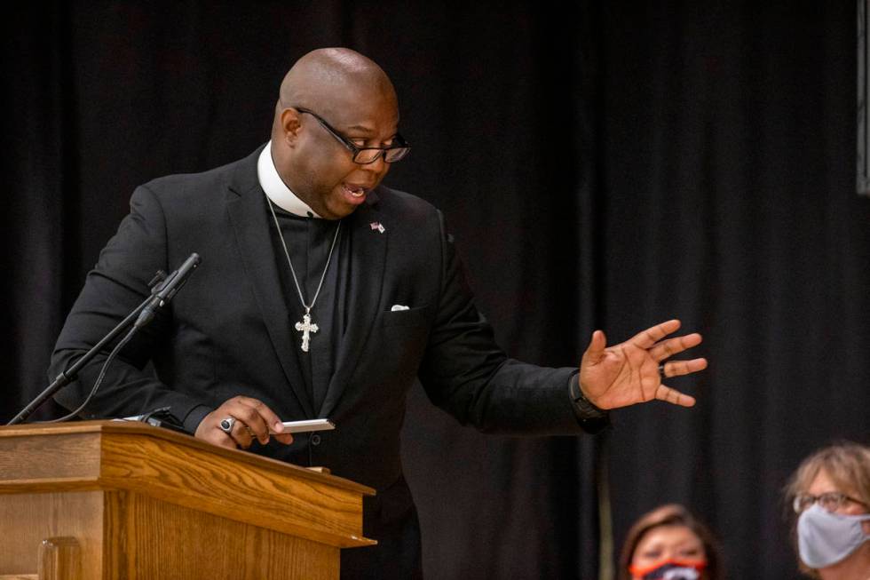 Pastor M.J. Ivy with the Kinship Community Church speaks during a public memorial service for f ...