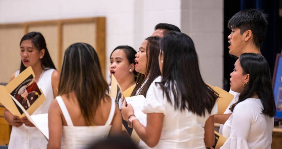 Members of the Filipino Teachers of Las Vegas choir sing a song during a public memorial servic ...