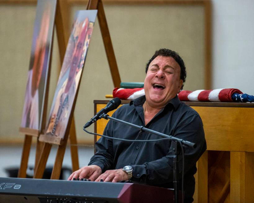 Performer Frankie Scinta sings a Beatles song during a public memorial service for former Metro ...