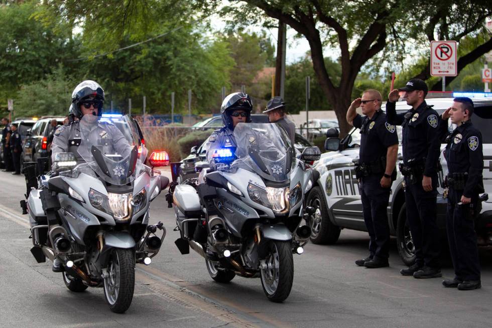 Law enforcement transports Nevada Highway Patrol trooper Micah May's body in a procession from ...