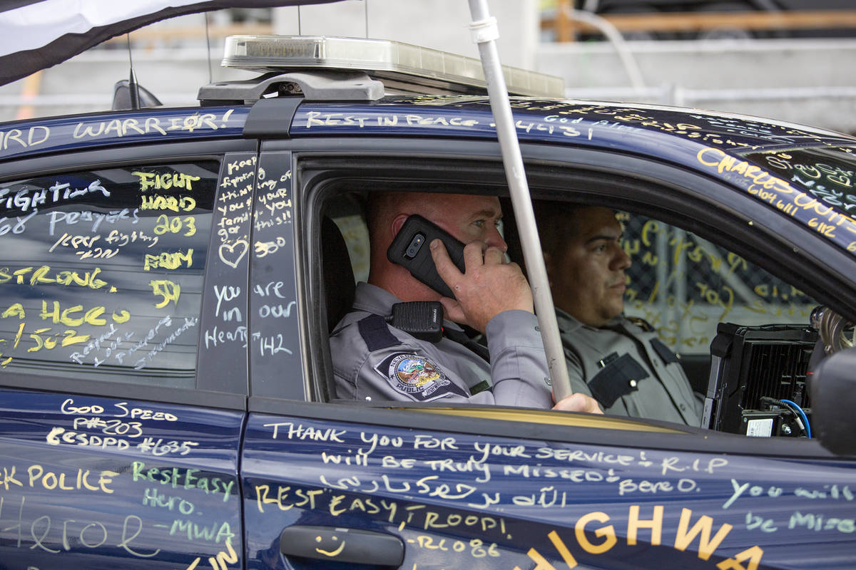 After a procession for Nevada Highway Patrol trooper Micah May's body to be transported from Un ...