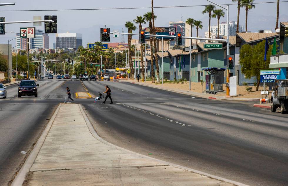 Pedestrians cross at the intersection of Stewart Avenue and North 28th Street, which is determi ...