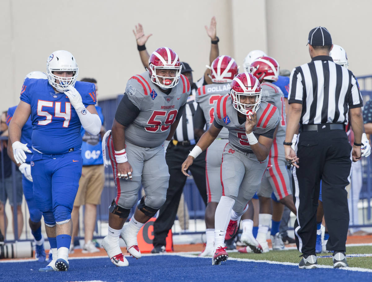 Mater Dei senior wide receiver Bru Mccoy (5) celebrates after scoring a first quarter touchdown ...