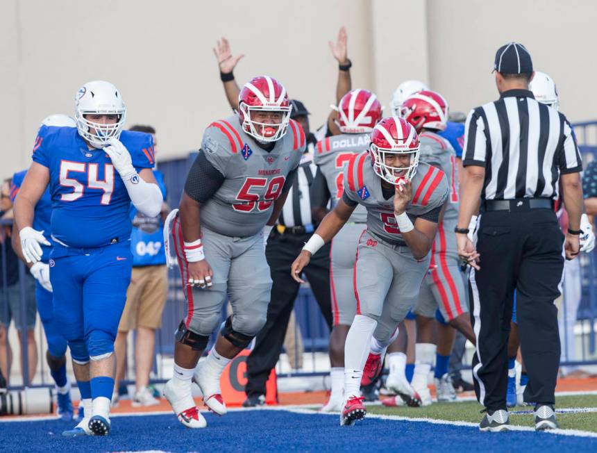 Mater Dei senior wide receiver Bru Mccoy (5) celebrates after scoring a first quarter touchdown ...