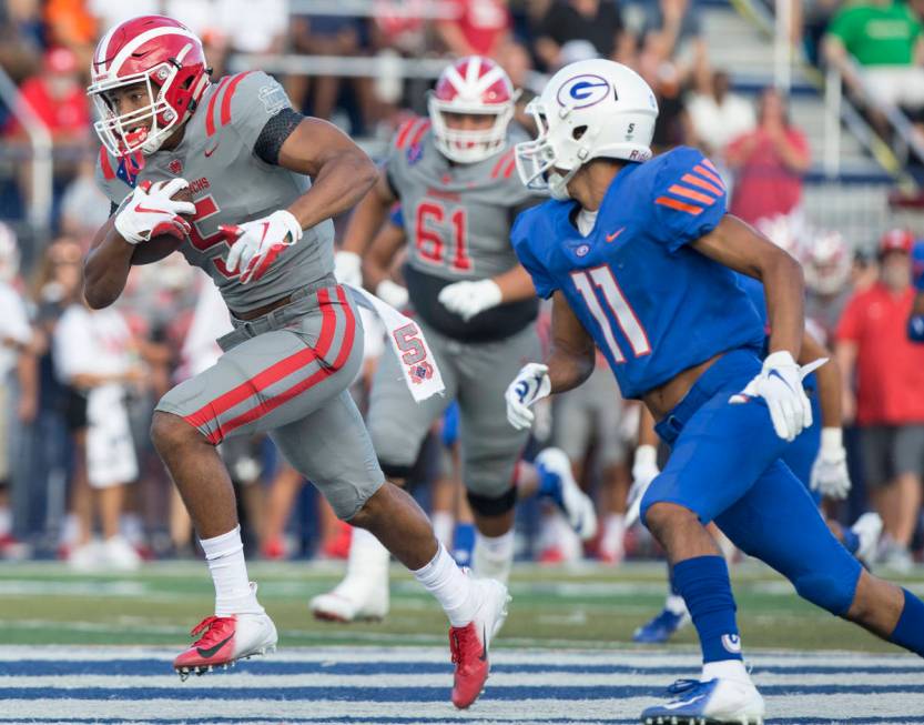 Mater Dei senior wide receiver Bru Mccoy (5) breaks off a big run past Bishop Gorman senior def ...