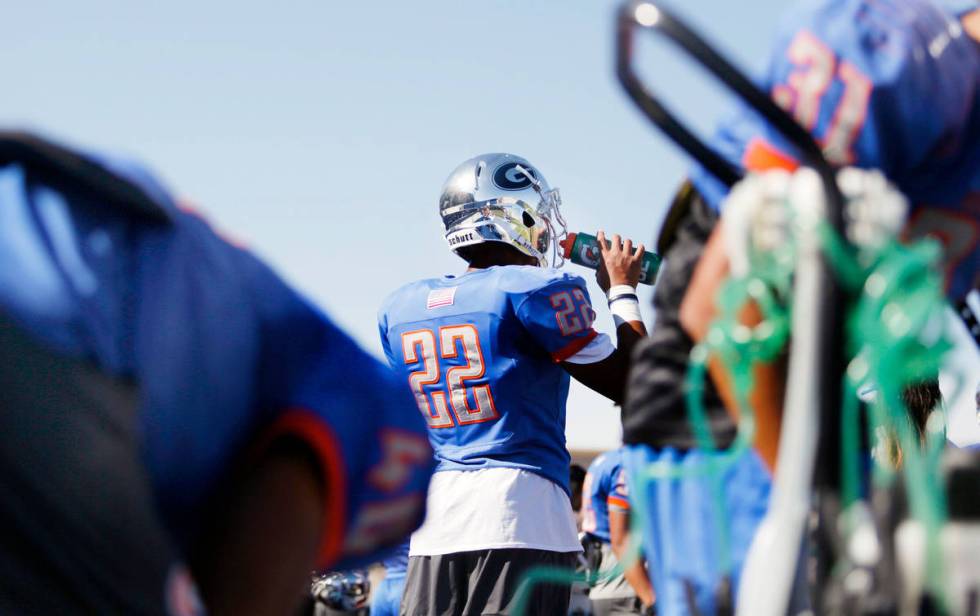 Bishop Gorman linebacker Benjamin Hudson (22) hydrates during practice at Bishop Gorman High Sc ...