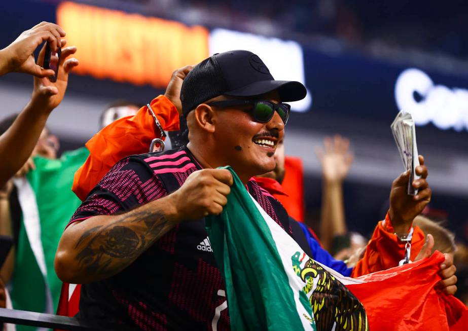 A Mexico fan cheers during the first half of the Concacaf Gold Cup final soccer match against t ...