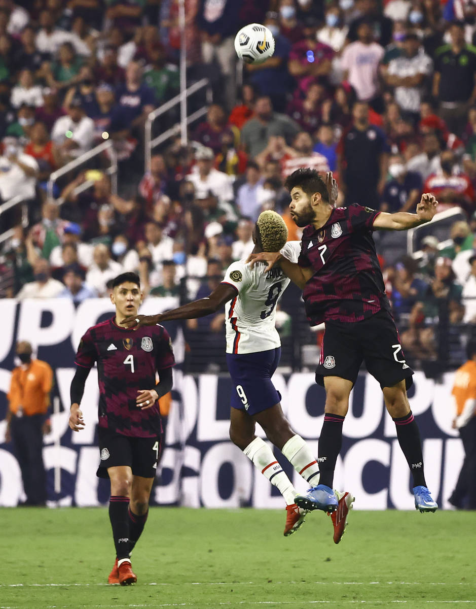 United States forward Gyadi Zardes (9) and Mexico defender Nestor Araujo (2) go up for a header ...