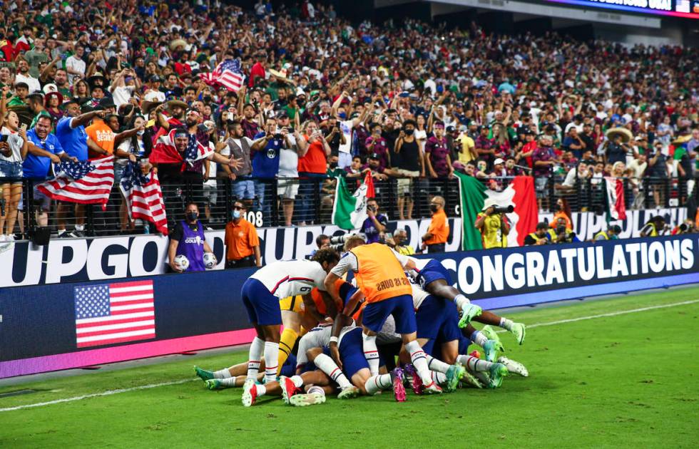 United States players celebrate after defeating Mexico 1-0 in extra time to win the Concacaf Go ...