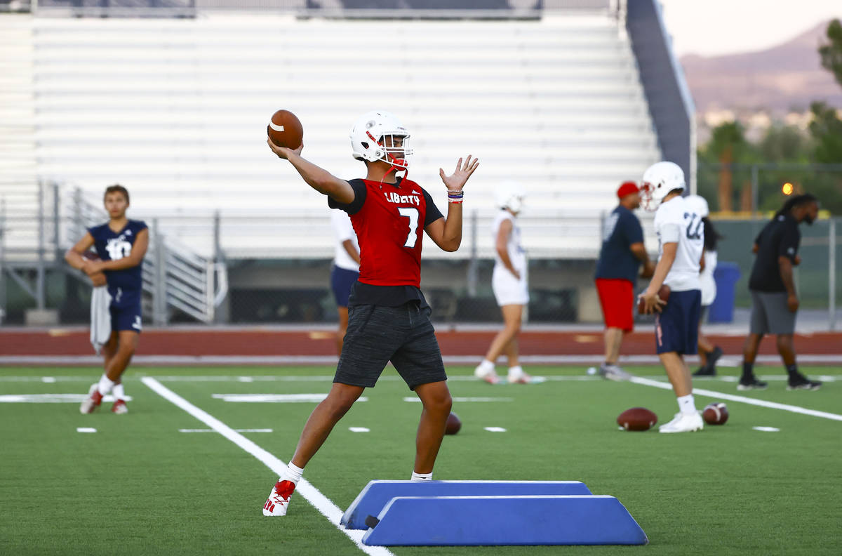 Liberty quarterback Jayden Maiava runs through drills during football practice in Henderson on ...