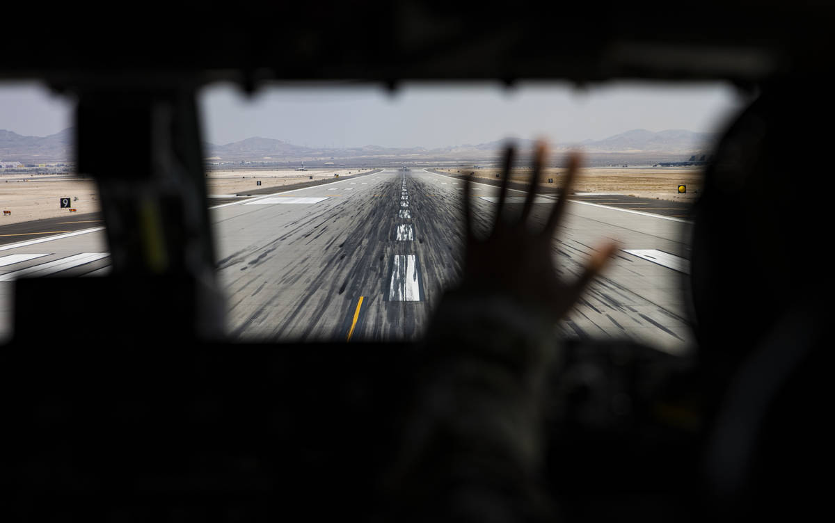 Capt. Jessica Rothmeier, of the 350th Air Refueling Squadron, signals on the runway before take ...
