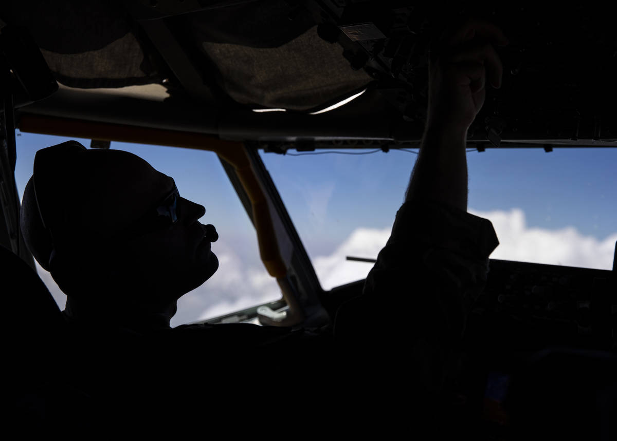 Capt. Chase Cooper, left, of the 350th Air Refueling Squadron, flies a KC-135 refueling tanker ...