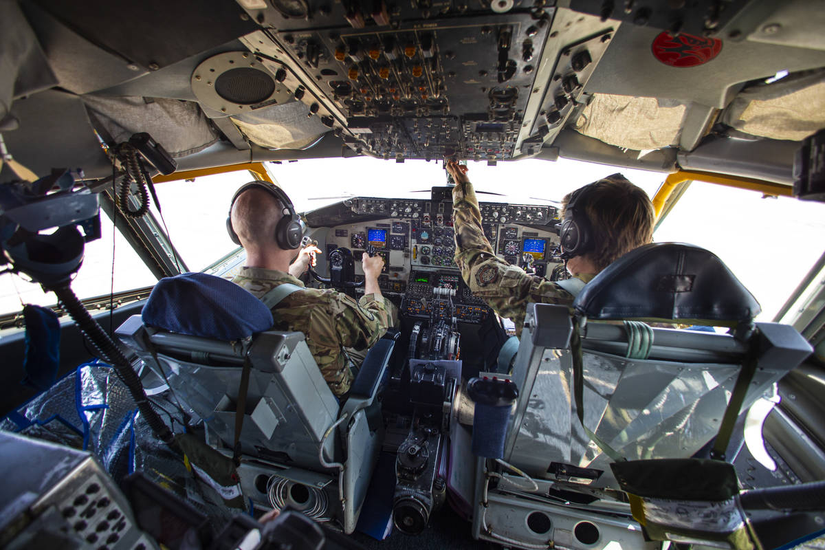 Captains Chase Cooper, left, and Jessica Rothmeier, of the 350th Air Refueling Squadron, fly a ...