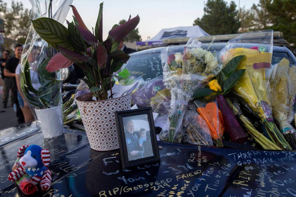 Nevada Highway Patrol trooper Micah May's former squad car is adorned with photos, signatures a ...