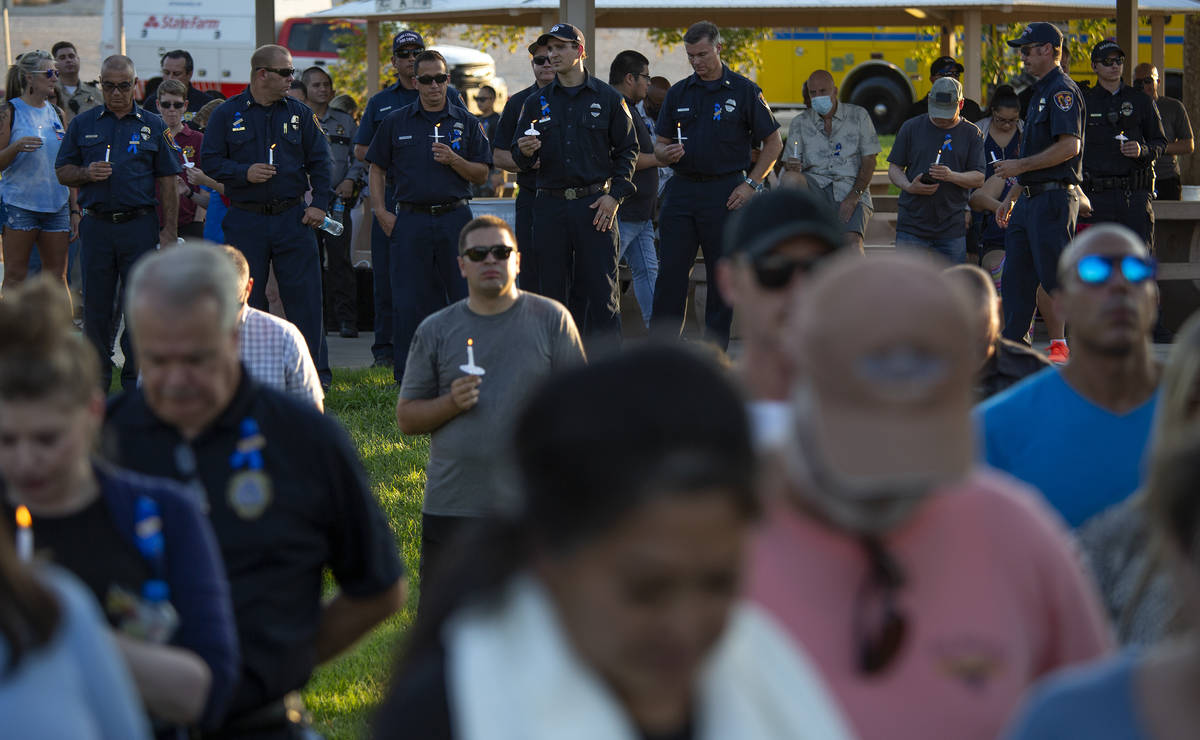 Law enforcement attends a vigil for Nevada Highway Patrol trooper Micah May at Police Memorial ...