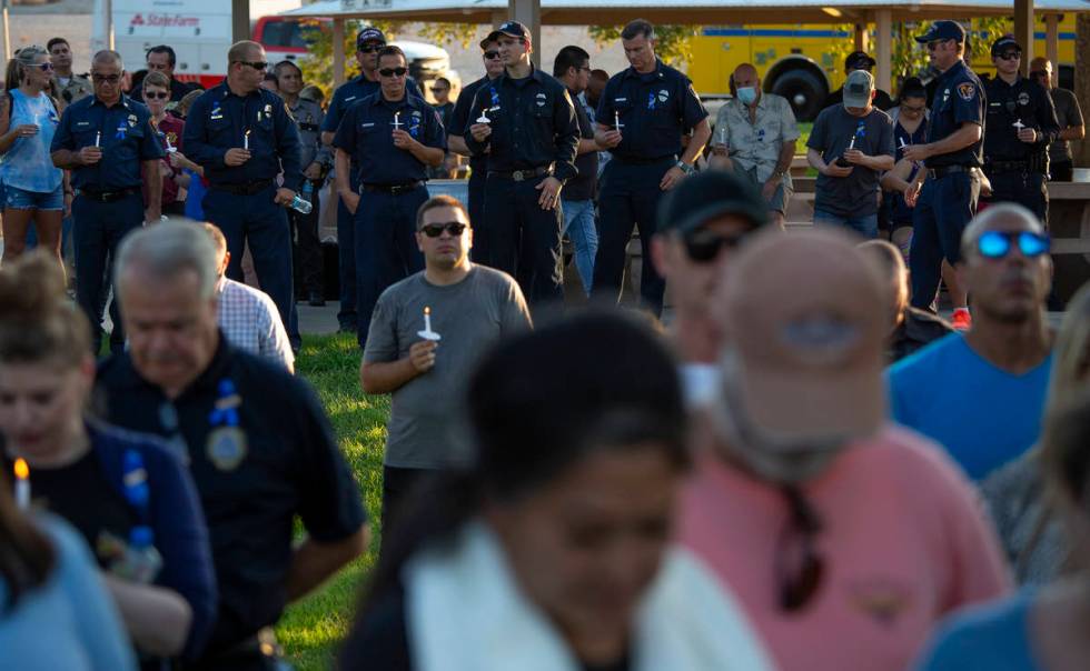 Law enforcement attends a vigil for Nevada Highway Patrol trooper Micah May at Police Memorial ...