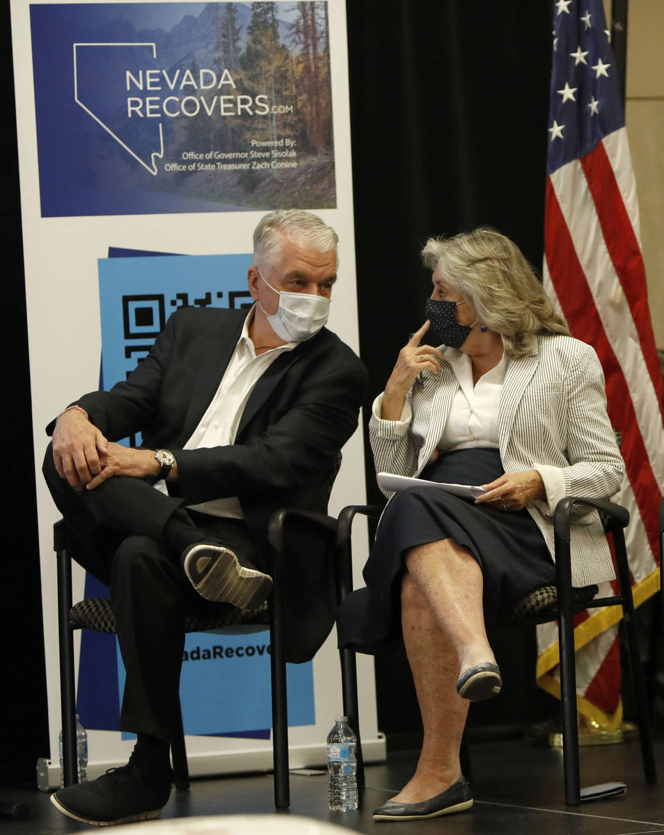 Nevada Gov. Steve Sisolak speaks to Rep. Dina Titus, D-Nev., during a kick-off event of the Nev ...