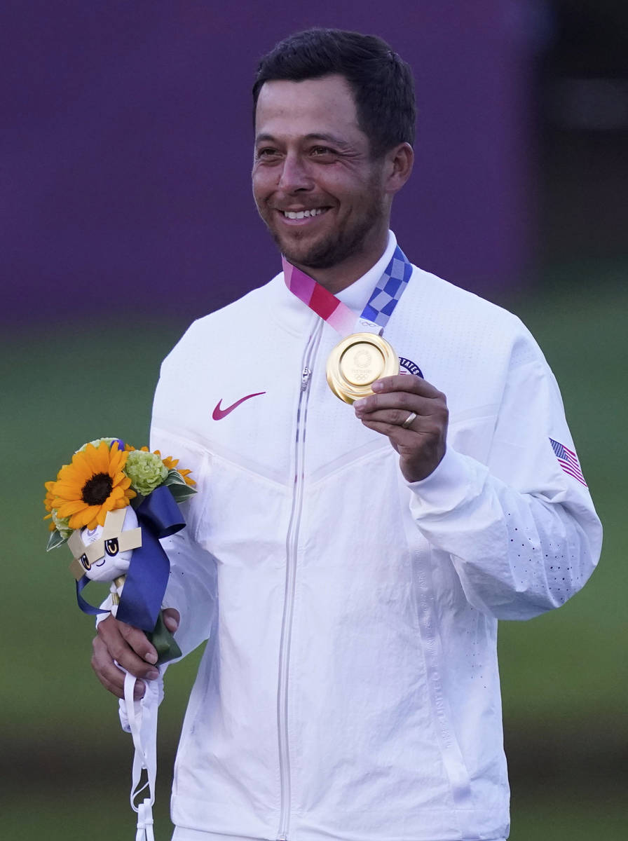 Xander Schauffele of the United States celebrates winning Gold in the Men's Golf event at the 2 ...