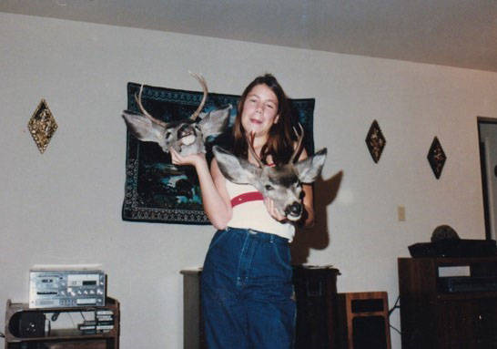 This undated photo shows Stephanie Isaacson posing with deer heads. Stephanie and her father, J ...
