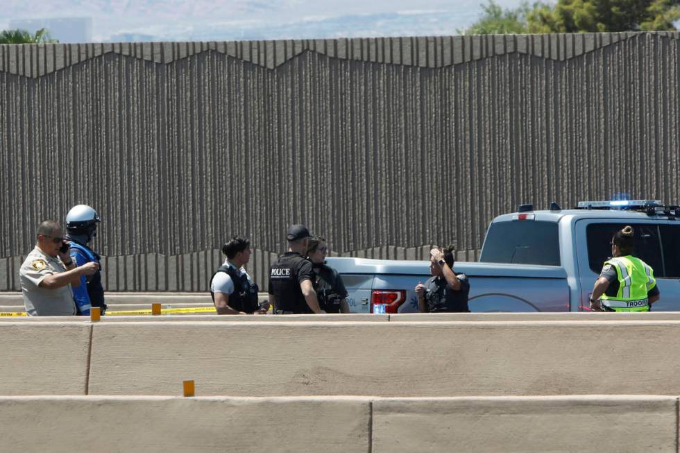 A heavy police presence is visible on Interstate 15 near Sahara Avenue in Las Vegas, Tuesday, J ...