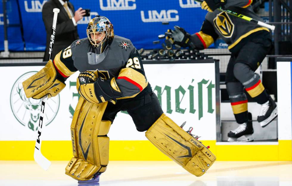 Golden Knights goaltender Marc-Andre Fleury warms up before the start of Game 5 of a first-roun ...